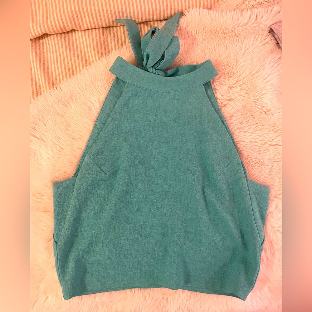 Just one Answer (JOA) open back crop top. Teal color.